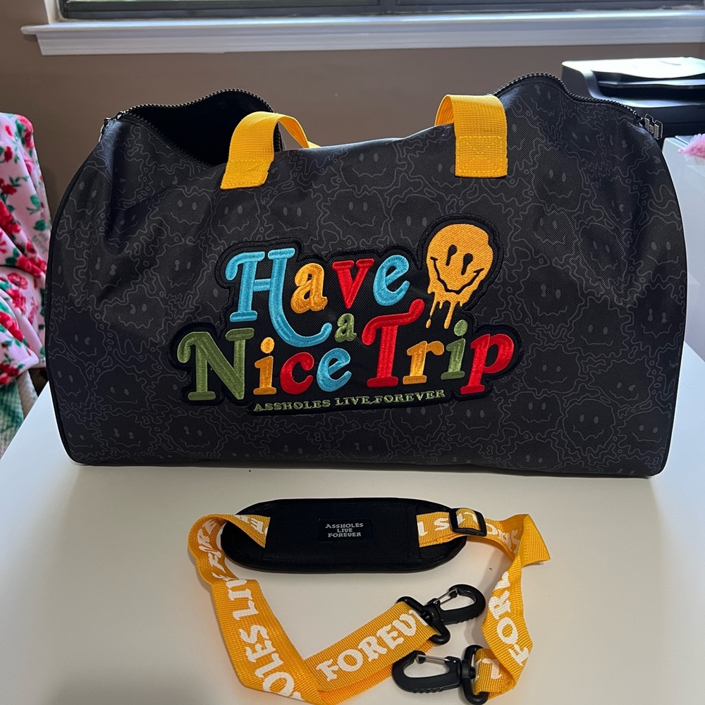 Assholes Live Forever “Have A Nice Trip” Duffle Bag